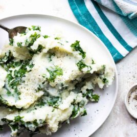 Colcannon on a white serving platter.