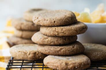 A stack of double ginger cookies on a cooling rack.