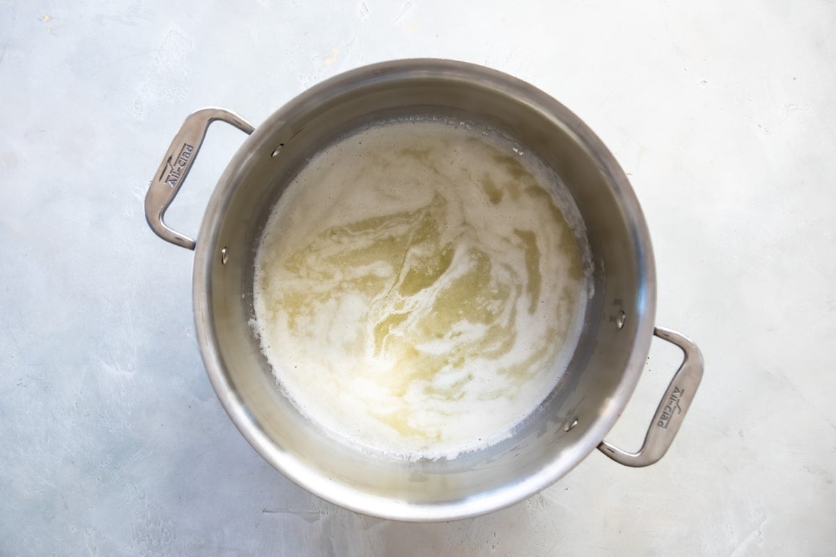Melted butter in a silver pot.