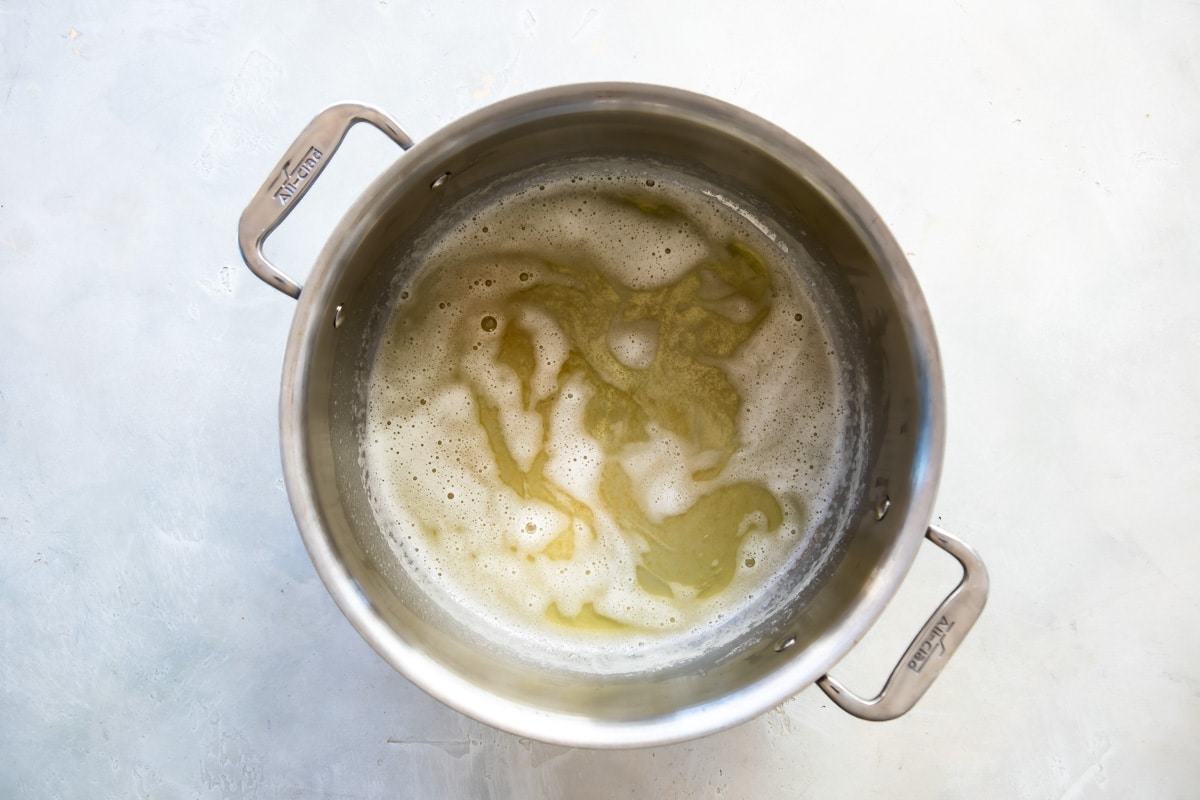 Melted butter in a silver pot.