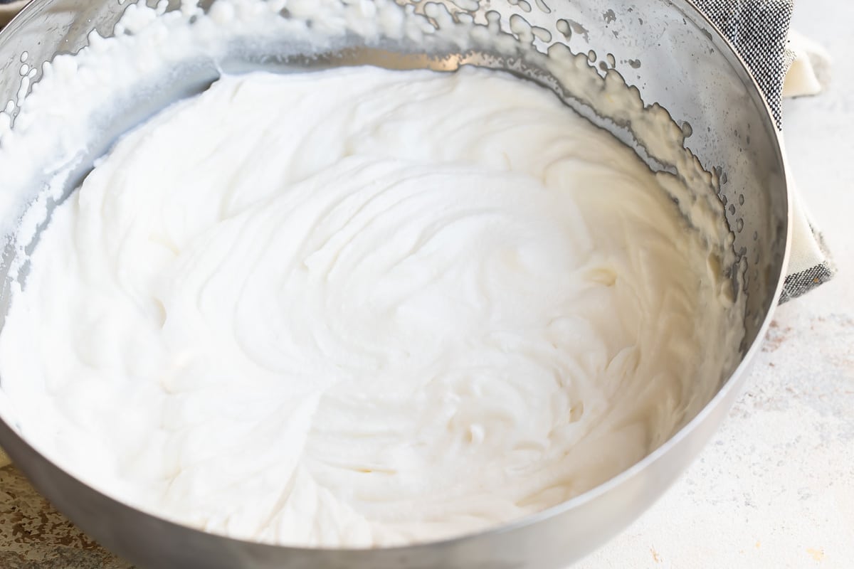A mixing bowl full of whipped cream.