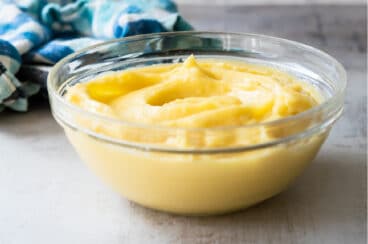 A clear bowl filled with pastry cream.
