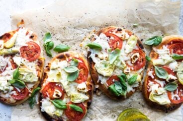 Easy flatbread pizza on a piece of brown parchment paper.