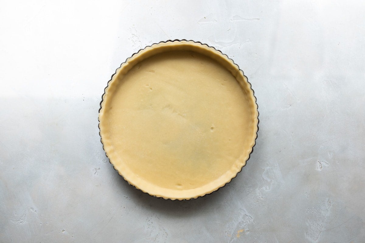 A tart crust before being cooked.