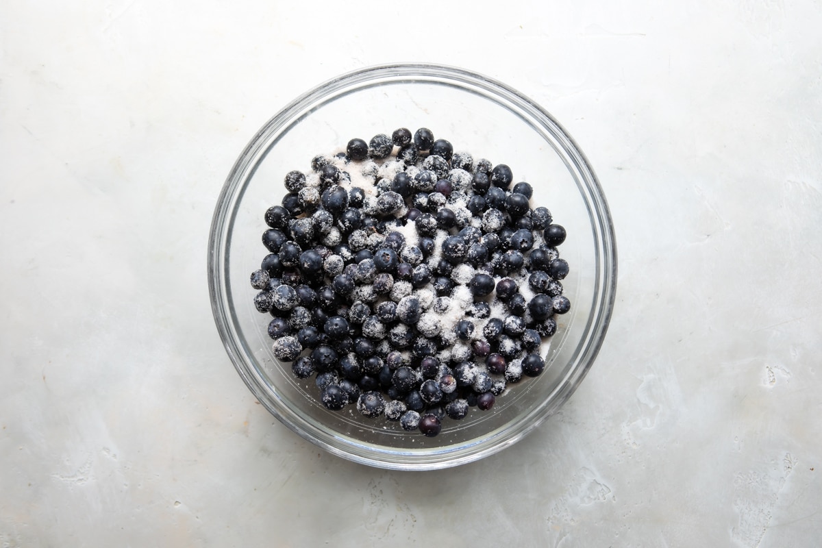 A bowl of blueberries tossed with sugar and spices.