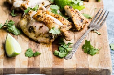 A cutting board full of sliced cilantro-lime chicken