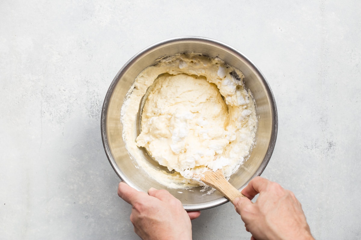 Lemon ricotta pancake batter in a mixing bowl.