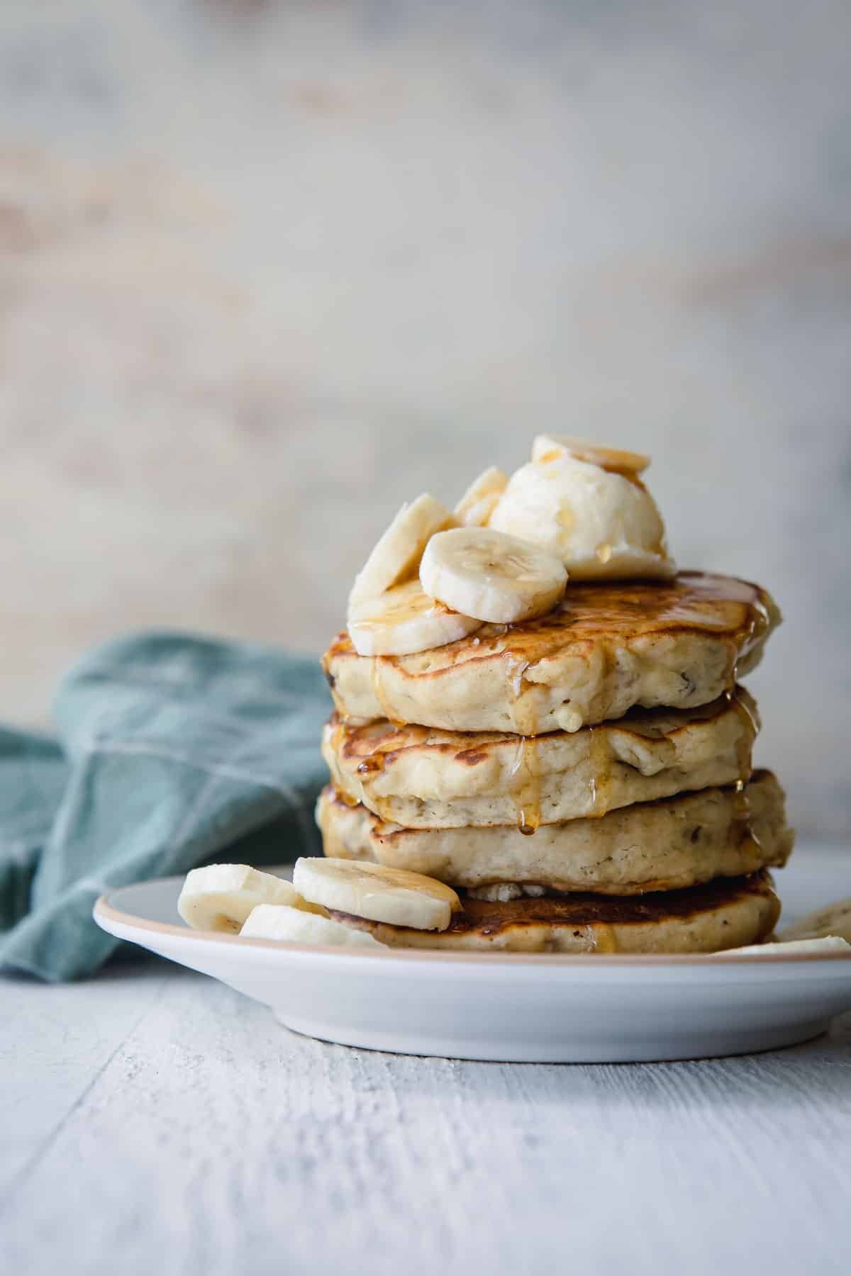 A stack of banana pancakes on a plate.