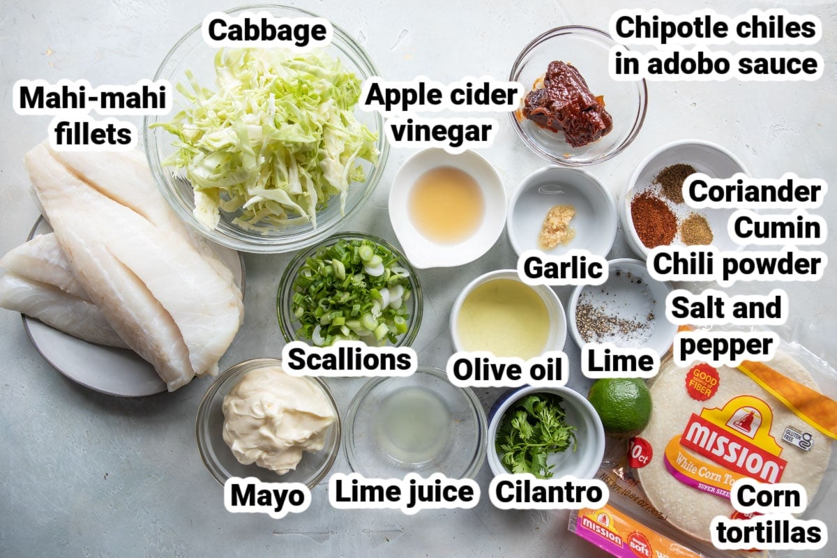 Labeled ingredients for grilled fish tacos with spicy slaw.