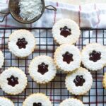Linzer cookies on a cooling rack.