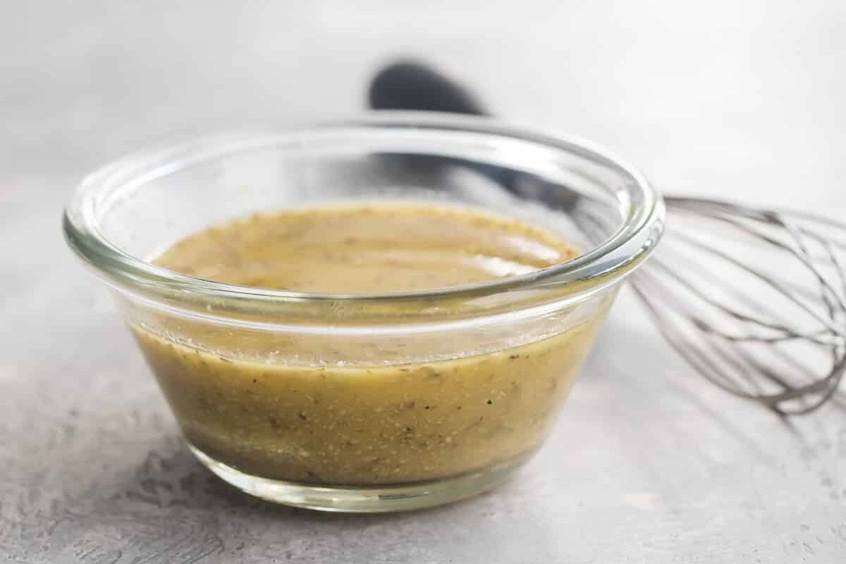 Chickpea salad dressing in a clear dish.