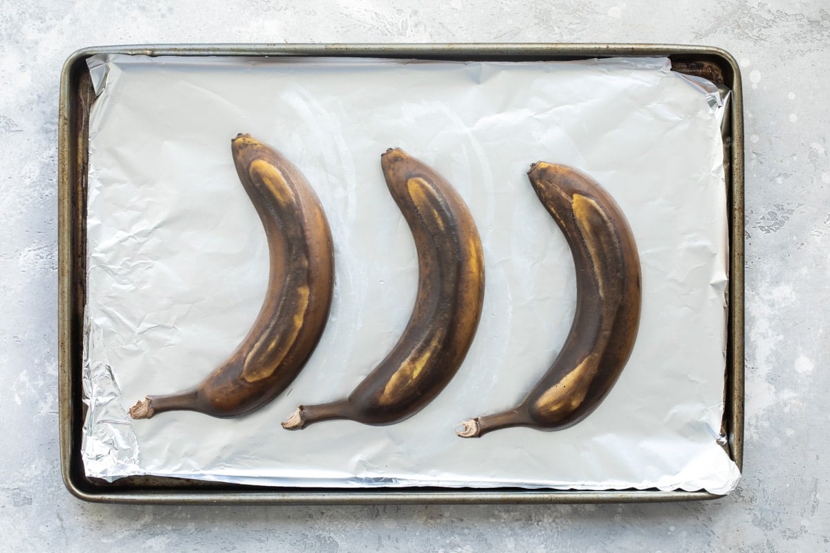 3 ripe bananas on a baking sheet.
