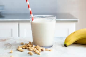 A peanut butter smoothie in a glass.