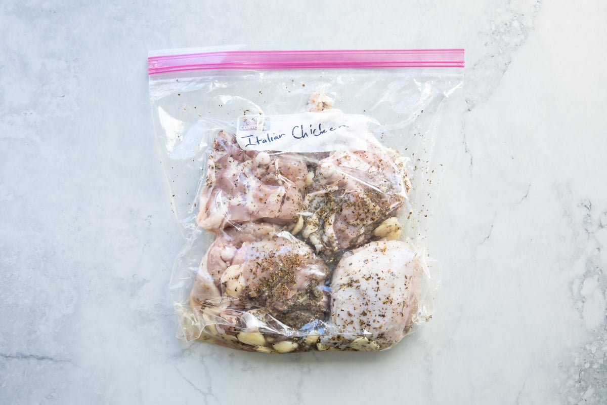 Italian chicken in a plastic bag with marinade.