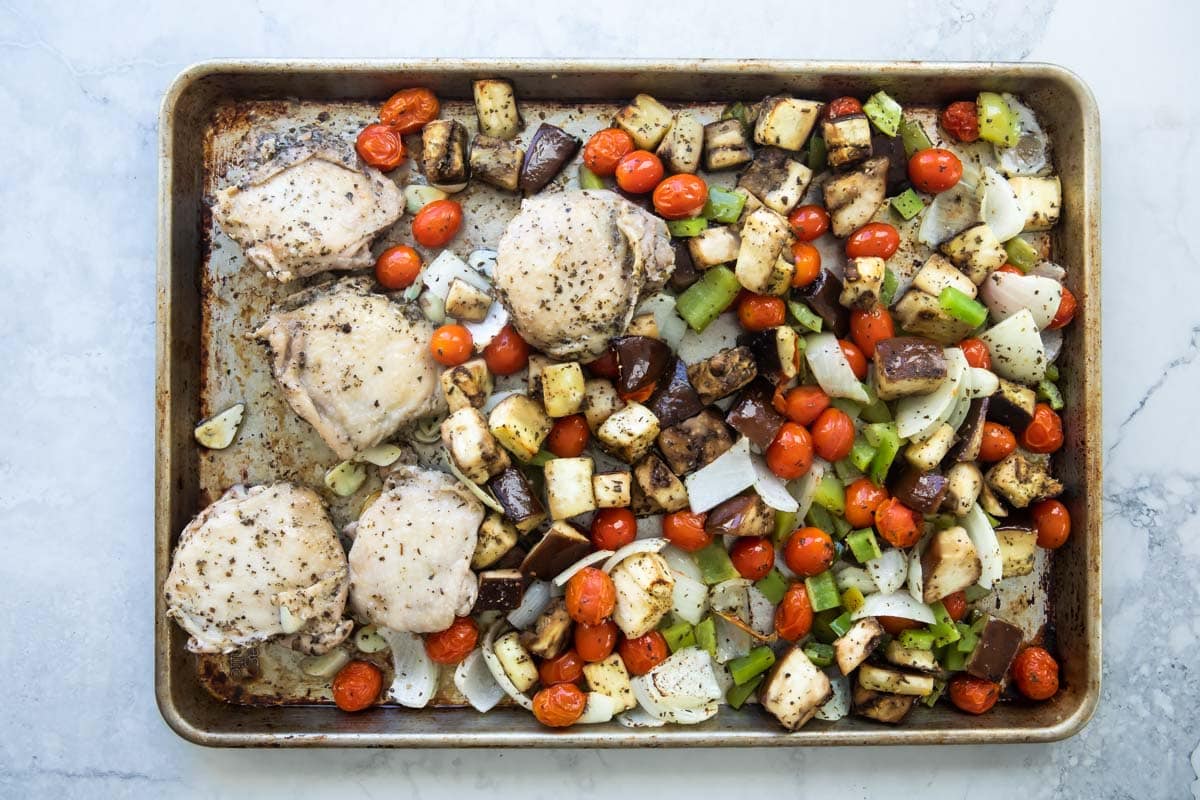 Italian-flavored roasted chicken on a sheet pan with veggies.