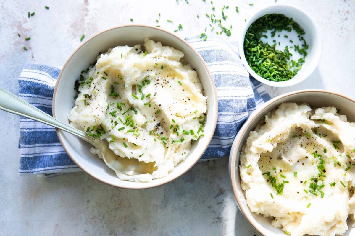 Bowls of mashed potatoes with chives.