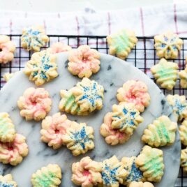 Spritz cookies on a cooling rack.