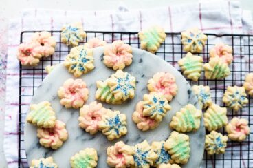 Spritz cookies on a cooling rack.