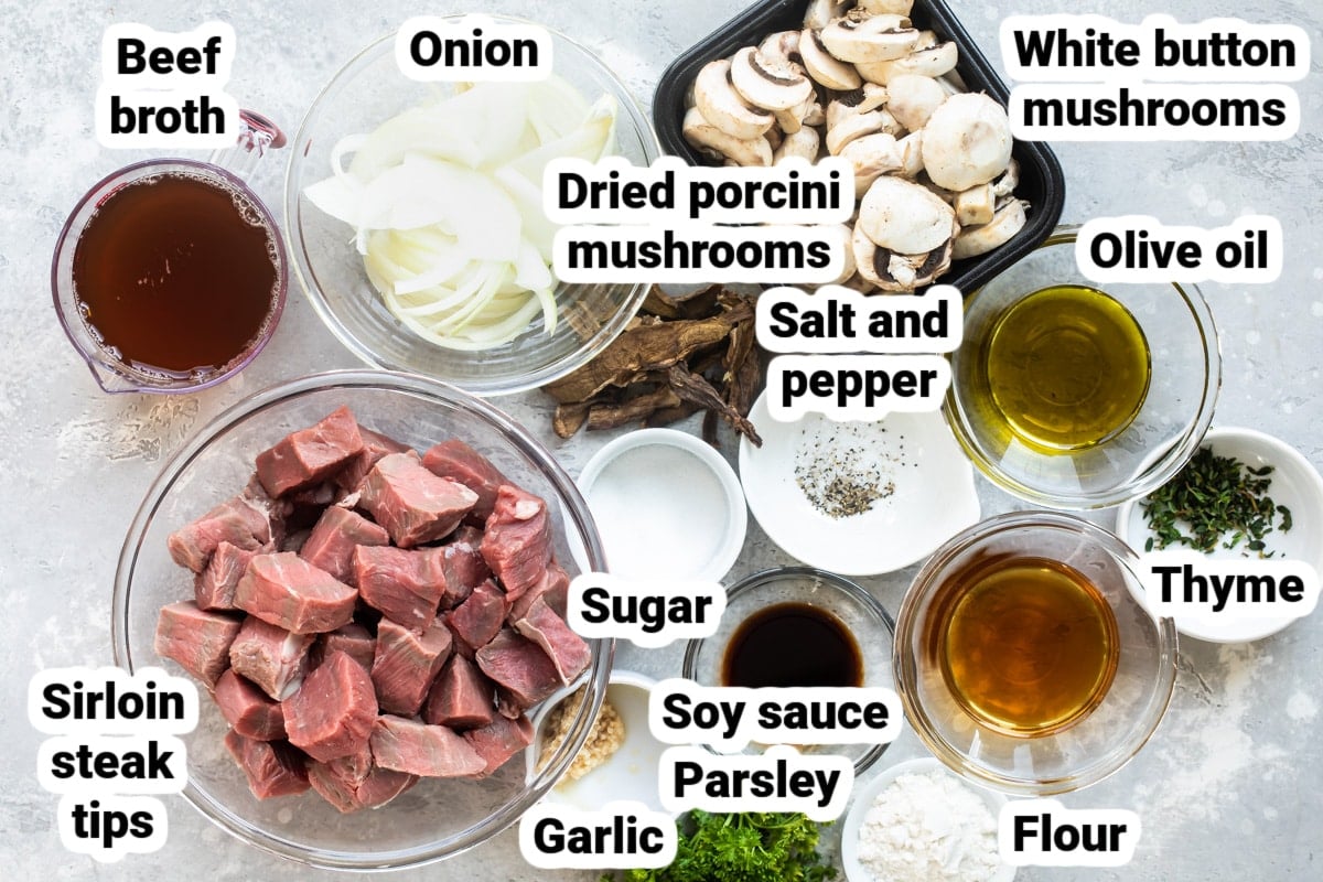 Labeled ingredients for steak tips with mushroom gravy in various bowls.