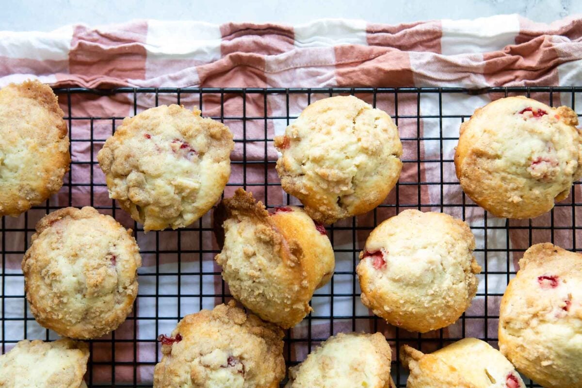 A rack filled with strawberry rhubarb muffins.