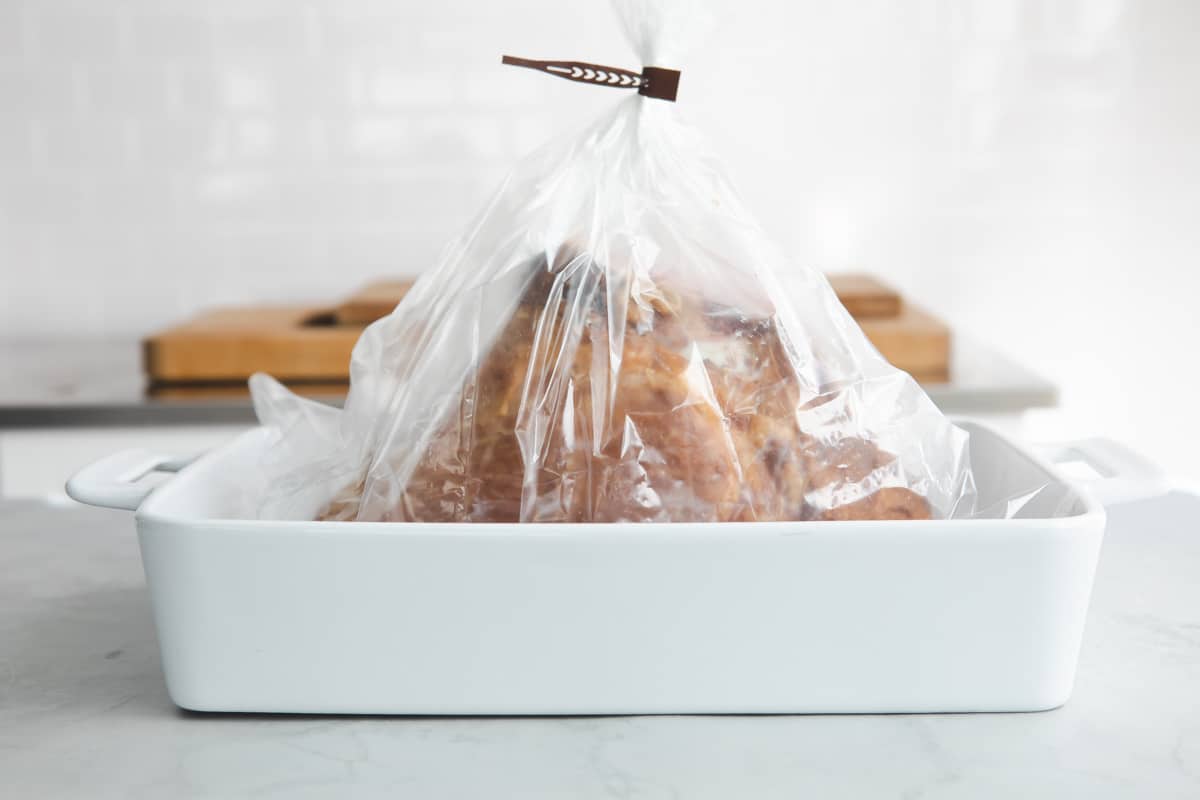 A smoked ham in an oven bag.