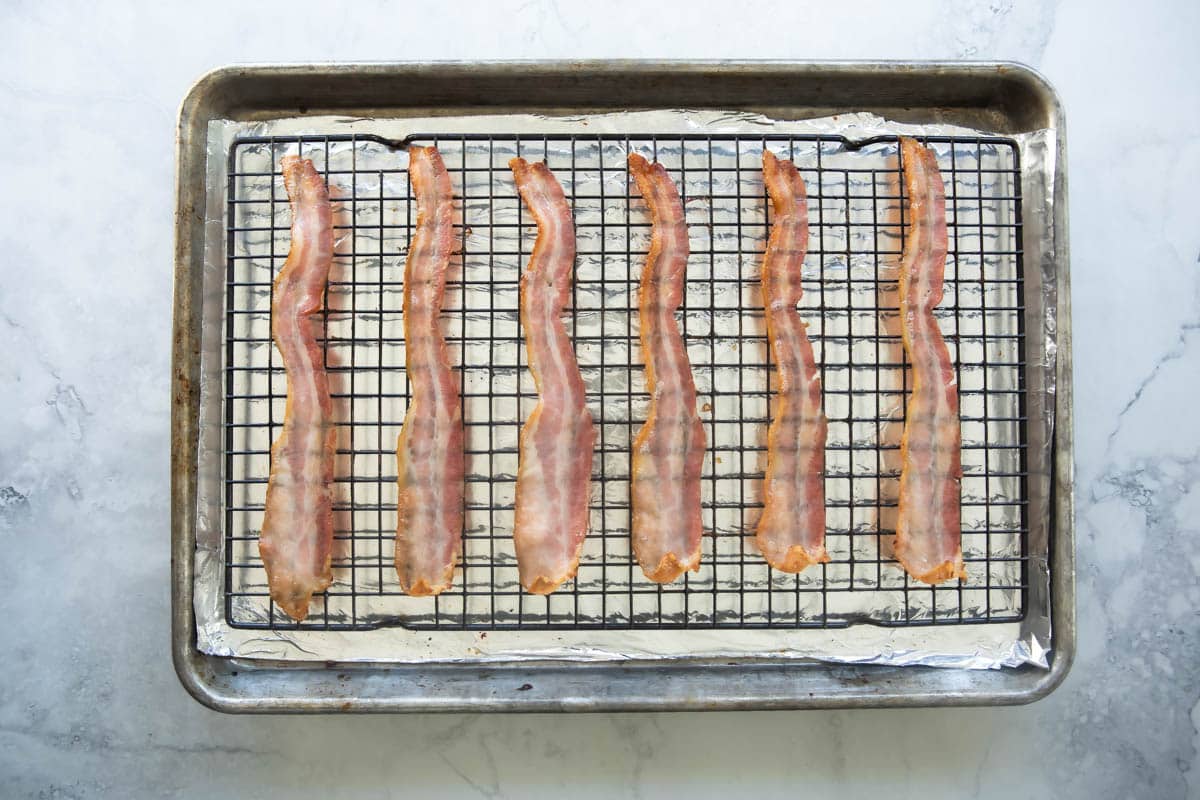 Cooking bacon on a rack in the oven.