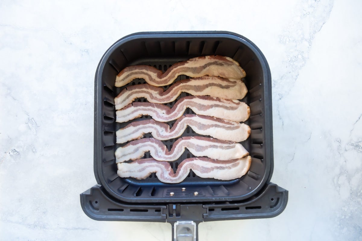 Cooking bacon in an air fryer.