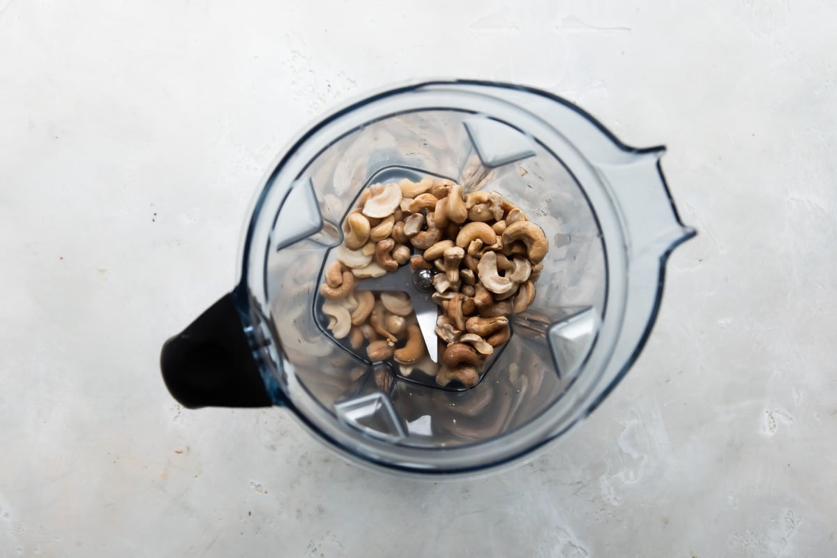 Raw cashews and water in a blender.