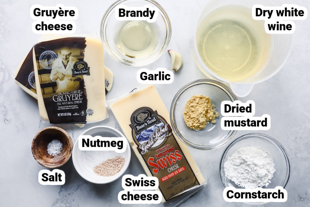 Labeled ingredients for cheese fondue.