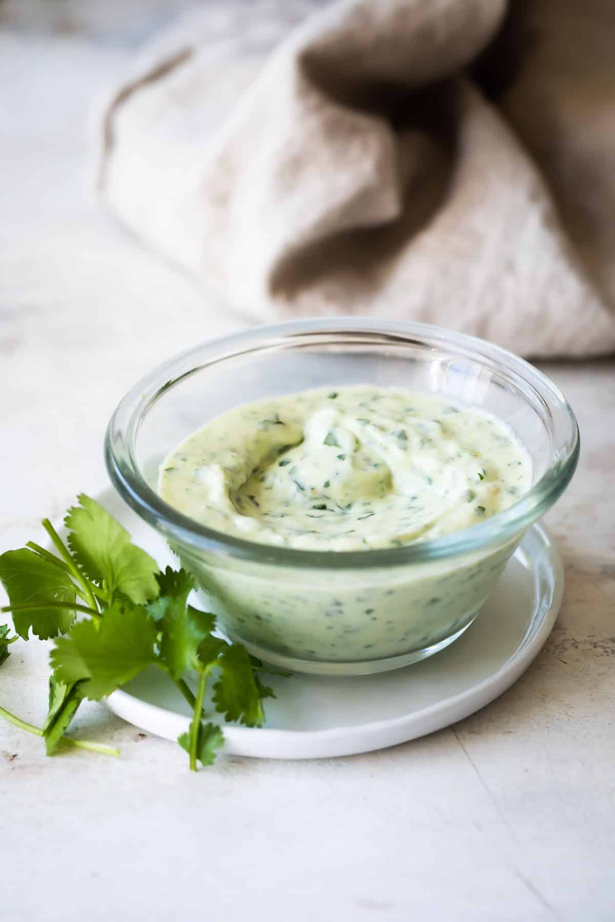 A clear dish of cilantro lime dressing.