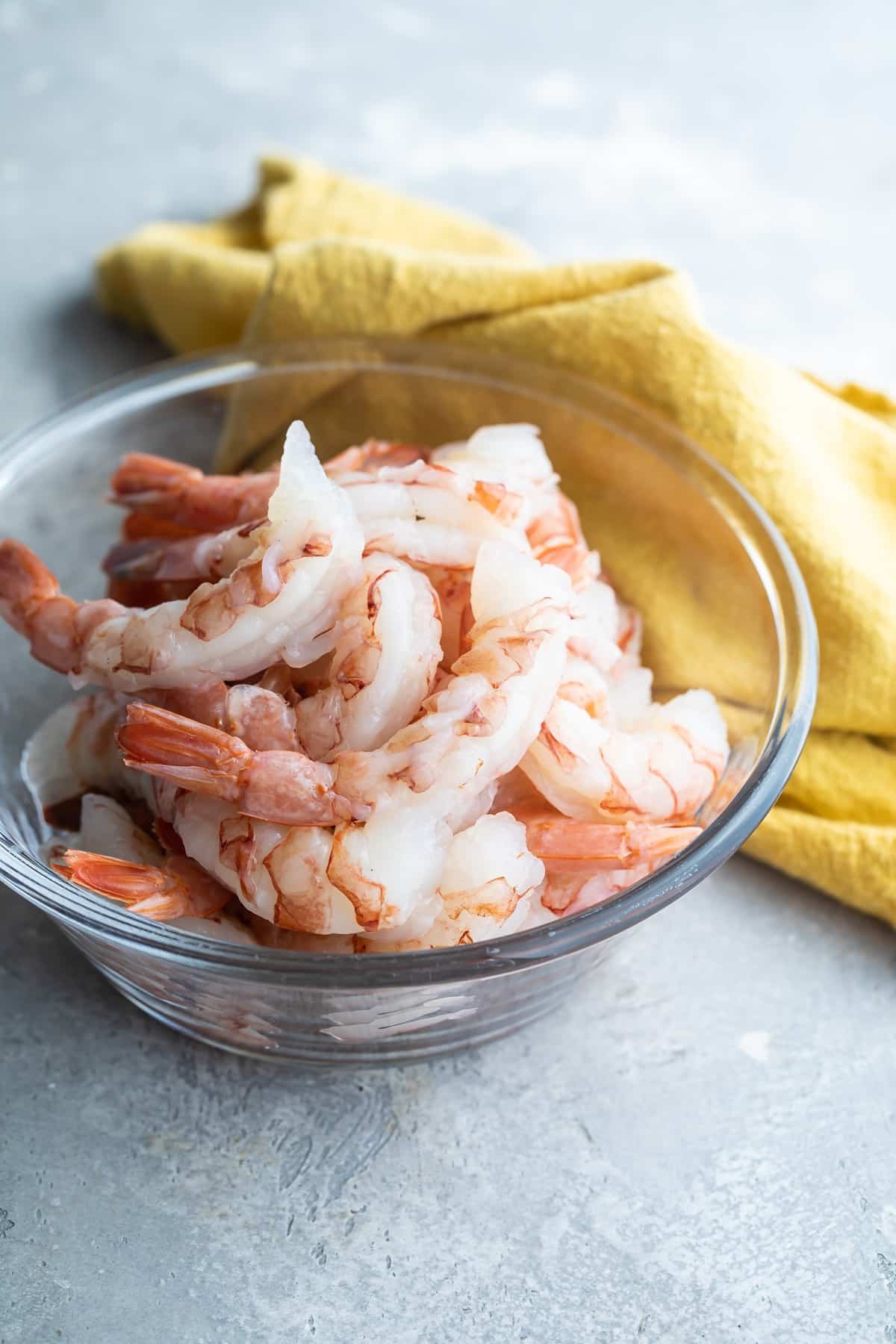 A bowl of peeled and deveined shrimp.