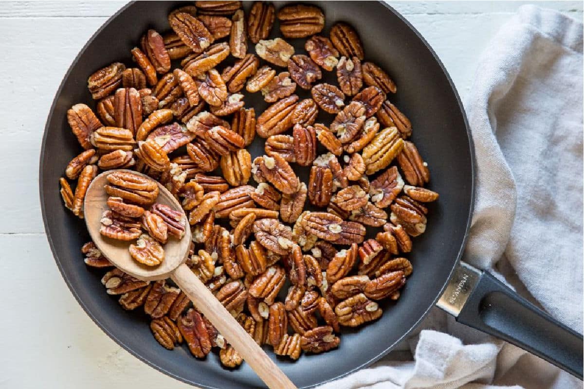 Toasted pecans in a pan.