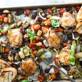 Italian-flavored roasted chicken on a sheet pan with veggies.