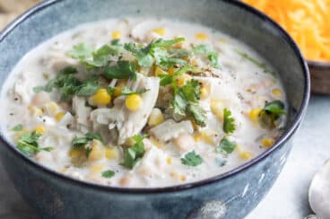 Slow cooker white chicken chili in a blue bowl.