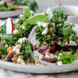 A plate with a serving of Mediterranean Lentil Salad.