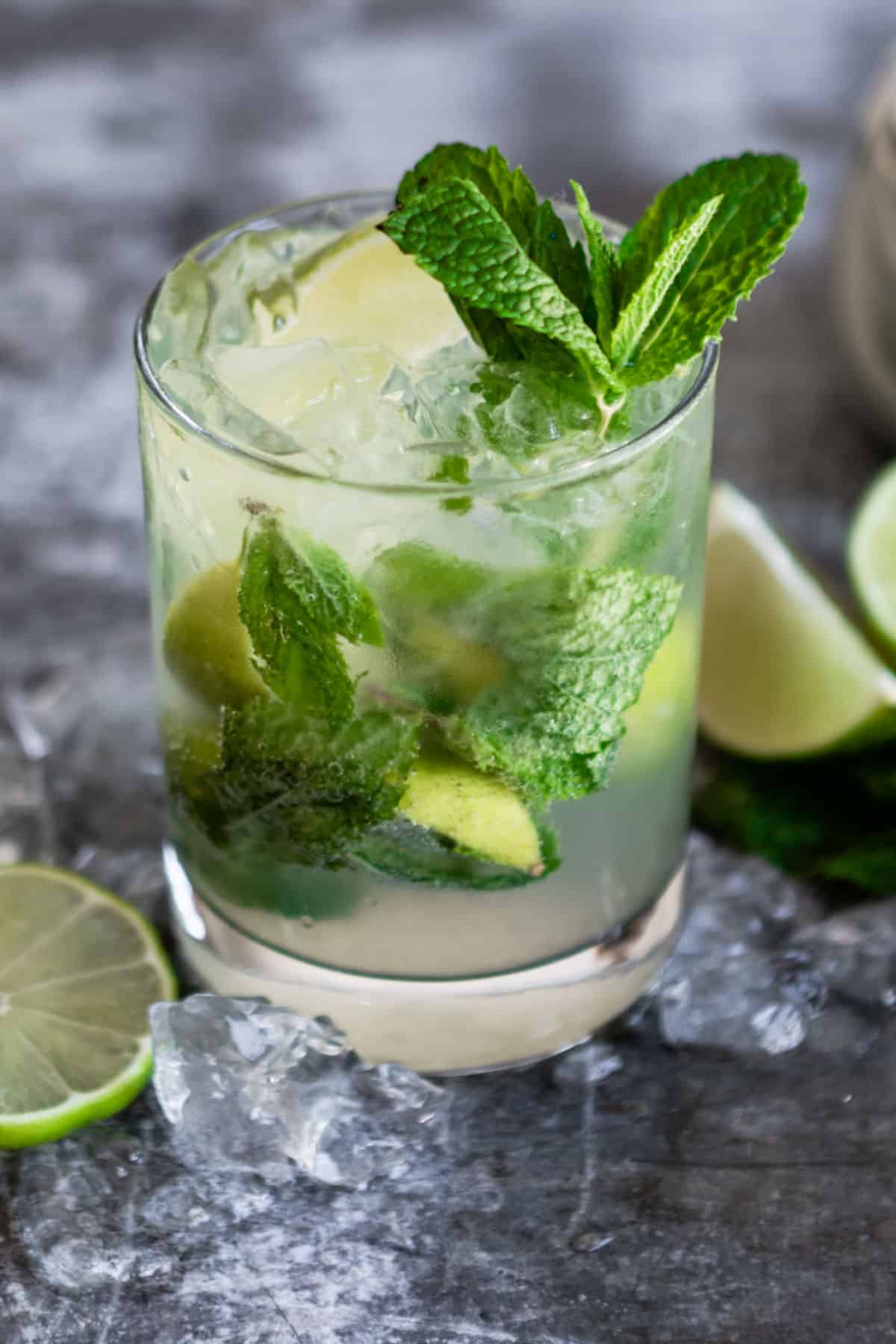 A virgin mojito mocktail in a clear glass.