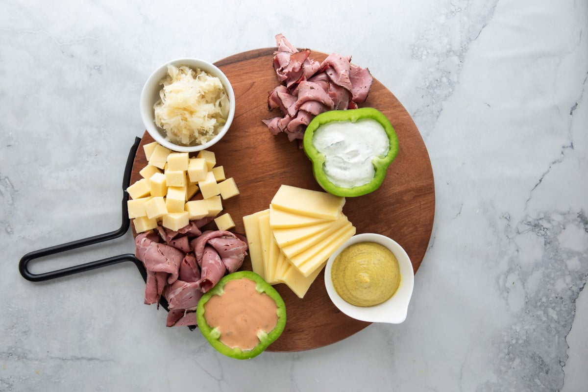 Meat and cheese on a St. Patrick's Day charcuterie board.