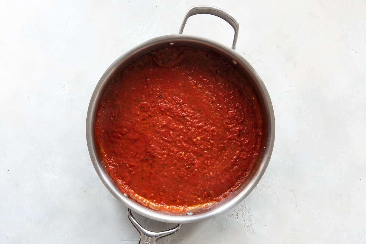 Marinara sauce in a skillet for chicken parmesan.
