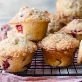Strawberry Rhubarb Muffins on a cooling rack.