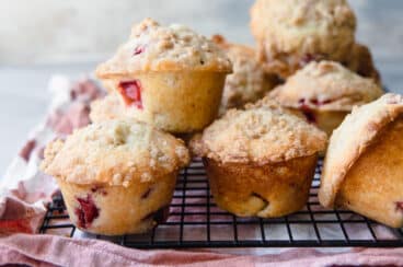 Strawberry Rhubarb Muffins on a cooling rack.