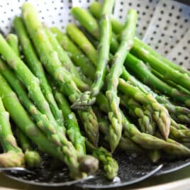 Asparagus in a steamer basket.