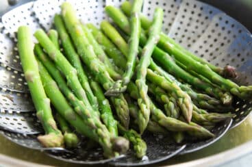Asparagus in a steamer basket.
